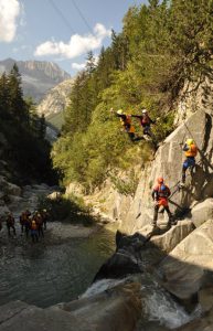 Jumping_from_rock_into_glacier_runnoff_while_canyoning_in_Interlaken_Switzerland