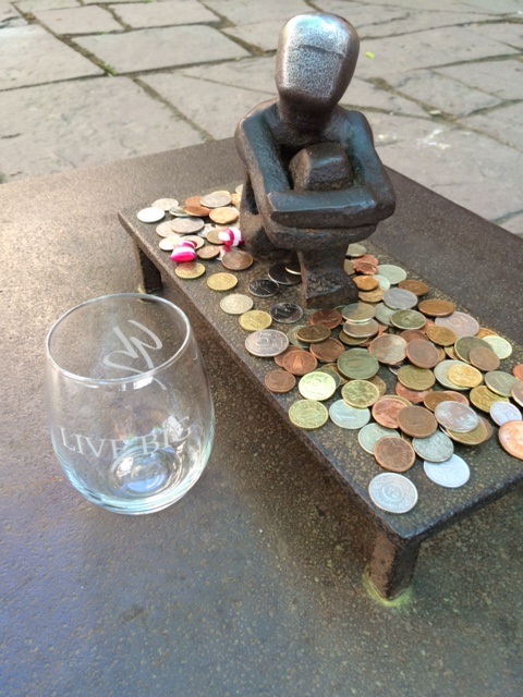 Submitted by John J. The Live Big glass traveled to Sweden and is pictures here next to Stockholm’s smallest statue in Gamla Stan – old town area. The name of the status is Little Boy Look at the Moon, but the locals simply call it Iron Boy.