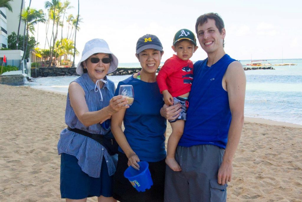Submitted by a Multigenerational Client Family. As seen by the smiling faces, the entire family enjoyed their "travel" Live Big glasses while on vacation at a beach near Diamond Head in Honolulu.